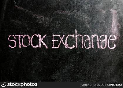 business STOCK EXCHANGE written on blackboard