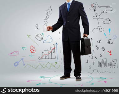 Business strategy. Businessman holding suitcase against sketch background. Business travel