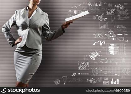 Business strategy. Close up of businesswoman with papers in hand