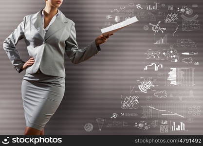 Business strategy. Close up of businesswoman with papers in hand