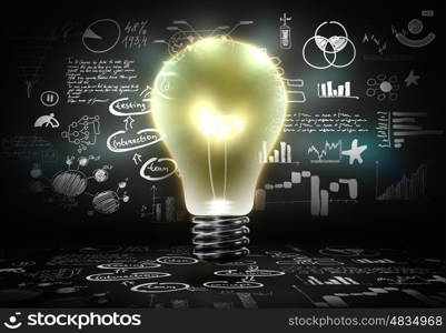 Business strategy. Conceptual image with light bulb and business sketches