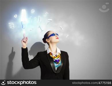 Business strategy. Image of businesswoman in goggles with business collage at background. Idea concept