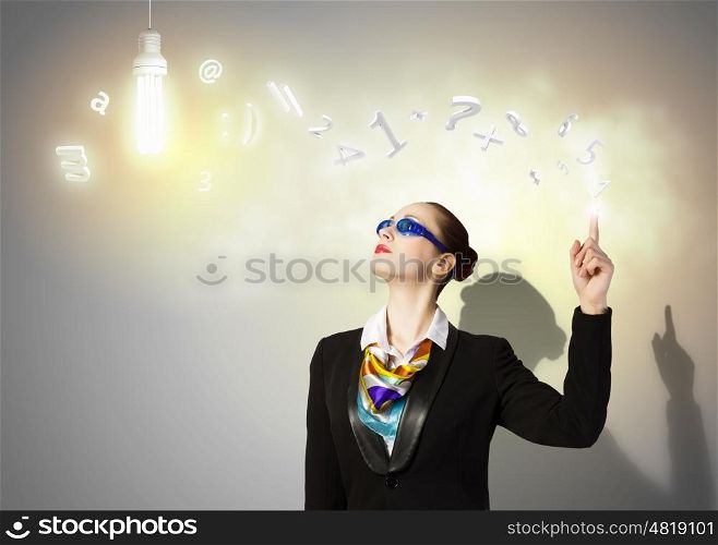 Business strategy. Image of businesswoman in goggles with business collage at background. Idea concept