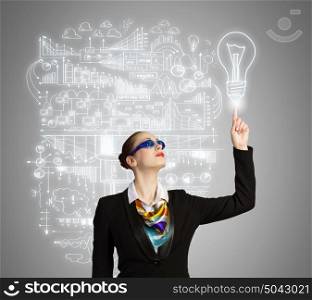 Business strategy. Image of businesswoman in goggles with business sketch at background. Idea concept