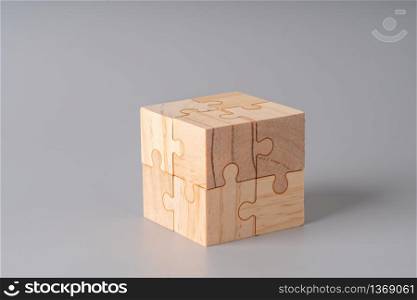 Business & strategy on wood jigsaw puzzle cube