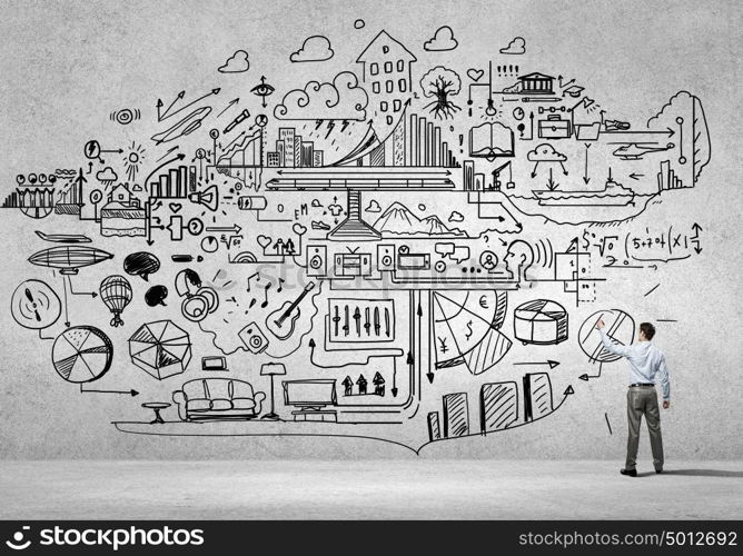 Business strategy. Rear view of businessman drawing business sketch on wall