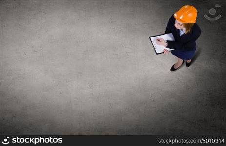 Business strategy. Top view of businesswoman looking at business sketches