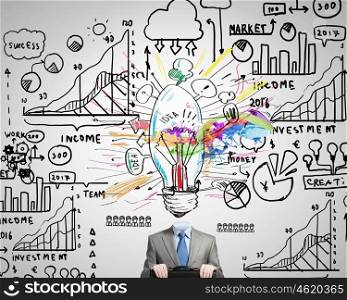 Business strategy. Unrecognizable businessman with business sketches instead of head on white background