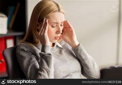 business, stress and people concept - close up of businesswoman feeling sick or suffering from headache at office work