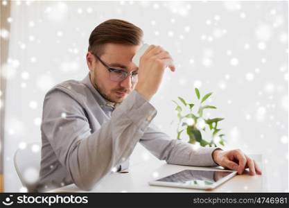 business, stress, fail, technology and people concept - businessman or creative male worker with smartphoneat home office over snow
