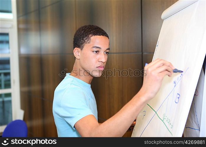 Business student drawing graph on flip-chart