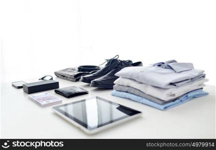 business, style and objects concept - formal male clothes, gadgets and personal stuff on white background. clothes, gadgets and business stuff on table