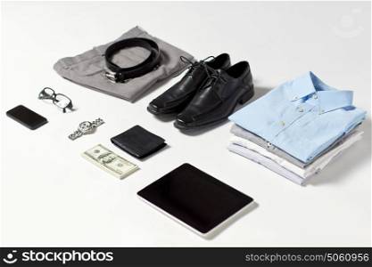 business, style and objects concept - formal male clothes, gadgets and personal stuff on white background. clothes, gadgets and business stuff on table