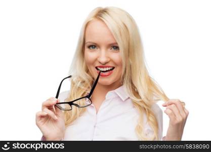 business, style and people concept - smiling businesswoman, student or secretary with glasses and red lipstick over white background