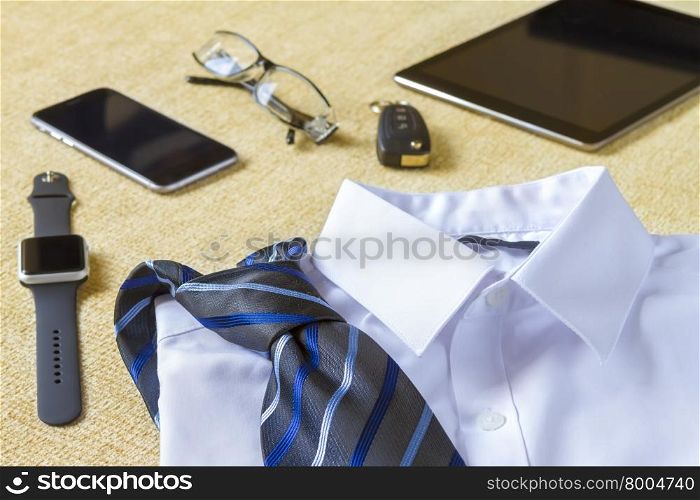 business, style, clothes and objects concept - close up of formal male clothes and personal stuff at home