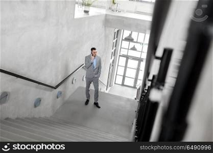 business, success and career lift concept - businessman walking upstairs. businessman walking upstairs. businessman walking upstairs