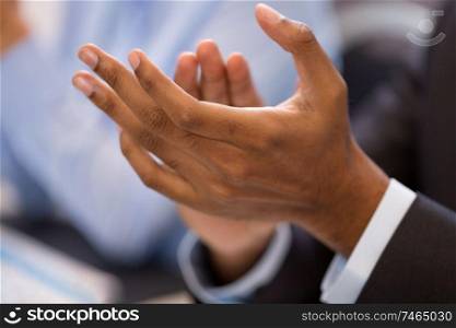 business, success and people concept - hands of businessman applauding at conference. hands of businessman applauding at conference