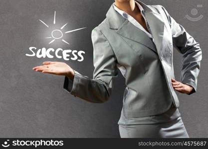 Business success. Close up of businesswoman and sketches at background