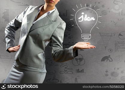 Business success. Close up of businesswoman and sketches at background