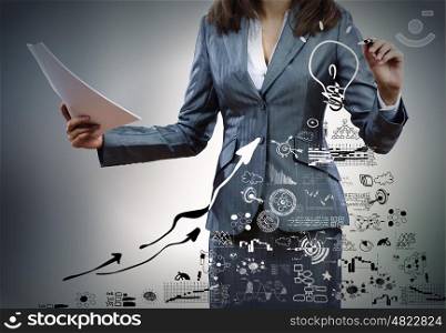 Business success strategy. Close up of businesswoman drawing business sketches