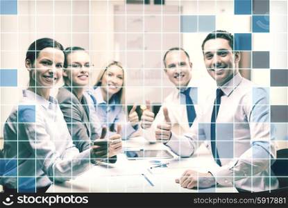 business, success, technology and office concept - smiling business team with tablet pc computer and papers showing thumbs up in office over blue squared grid background