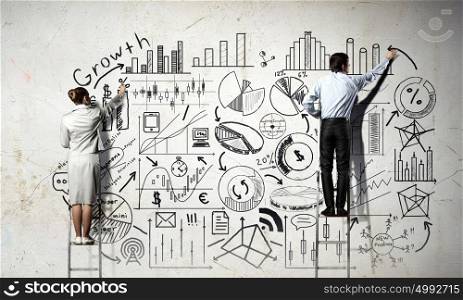 Business successful strategy. Back view of businessman and businesswoman standing on ladder and drawing plan on wall