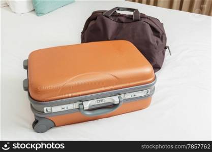 business suitcase on bed for traveling