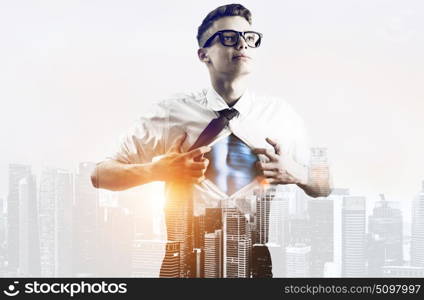 Business super hero double exposure. Business superhero double exposure concept. Young businessman showing super hero suit under his shirt