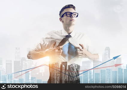 Business super hero double exposure. Business superhero double exposure concept. Young businessman showing super hero suit under his shirt