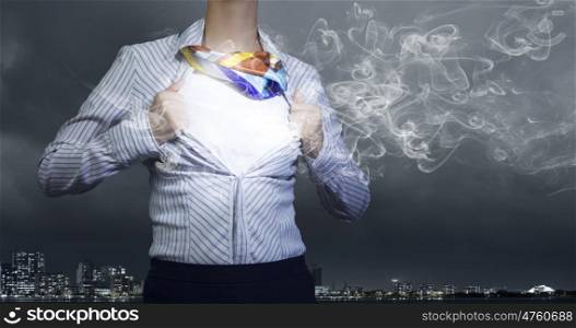 Business super power. Unrecognizable businesswoman opening her shirt like superhero