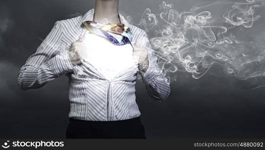 Business super power. Unrecognizable businesswoman opening her shirt like superhero