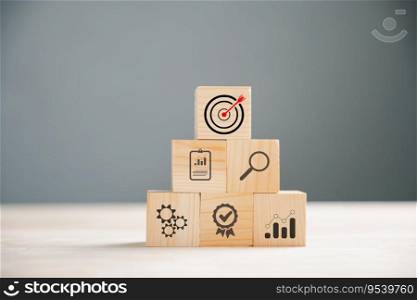 Business target concept on wooden block cude step. Action Plan and Goal icons symbolize success. Project management and company strategy on a table. Financial growth is the objective.