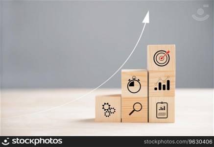 Business target concept with wooden block cude step. Action Plan and Goal icons represent success. Project management and company strategy on a table. Teamwork background.