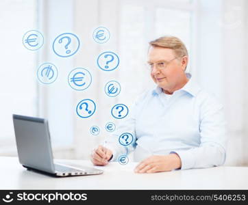 business, tax, office, school and education concept - old man in eyeglasses filling a form at home