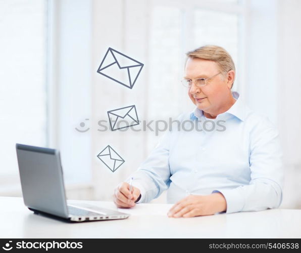 business, tax, office, school and education concept - old man in eyeglasses filling a form at home