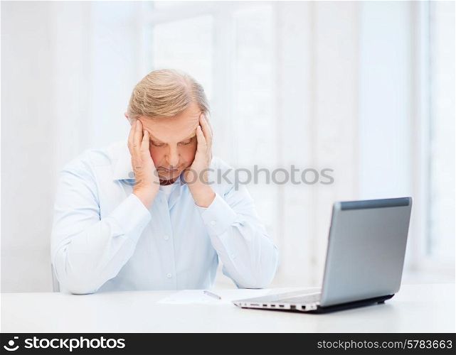 business, tax, office, school and education concept - stressed old man filling a form at home