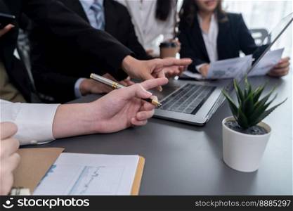 Business team analyze business analytic or business intelligence dashboard on laptop screen show graph and chart with statistic in harmony office. Analyst team meeting researching, planning strategy.. Closeup to view hand using laptop to analyze financial data in harmony office.