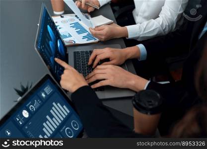 Business team analyze business analytic or business intelligence dashboard on laptop screen show graph and chart with statistic in harmony office. Analyst team meeting researching, planning strategy.