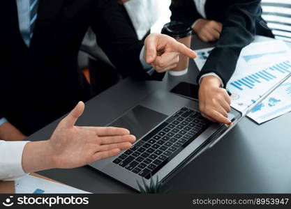 Business team analyze business analytic or business intelligence dashboard on laptop screen show graph and chart with statistic in harmony office. Analyst team meeting researching, planning strategy.