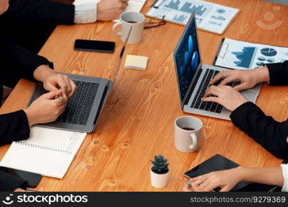 Business team analyze business analytic or business intelligence dashboard on laptop screen show graph and chart with statistic in harmony office. Analyst team meeting researching, planning strategy.