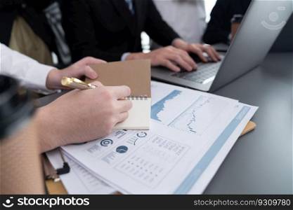 Business team analyze business analytic or business intelligence dashboard on laptop screen show graph and chart with statistic in harmony office. Analyst team meeting researching, planning strategy.