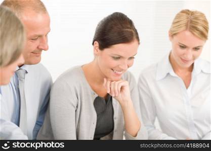 Business team attractive businesswomen with happy colleague male looking down