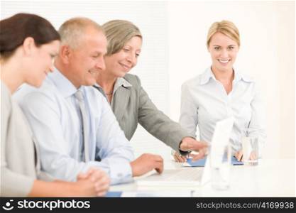 Business team attractive businesswomen with happy colleagues working around table