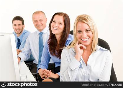 Business team attractive woman sit in line behind computer table