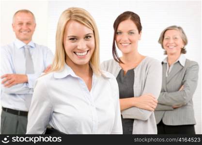 Business team attractive young businesswoman with happy mature colleagues