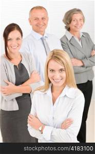 Business team attractive young businesswoman with happy mature colleagues