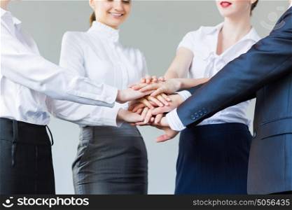 Business team. Business people making pile of hands. Partnership concept