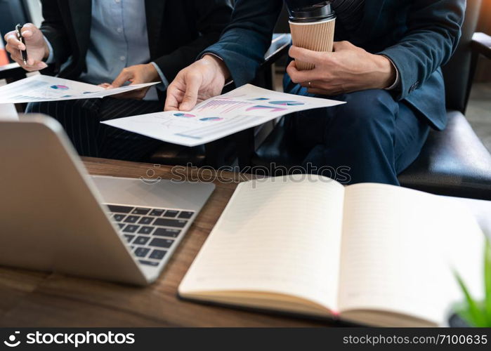 Business team cooperation coworking discussing about progress of business plan project advice and correcting mistakes during work in the Office