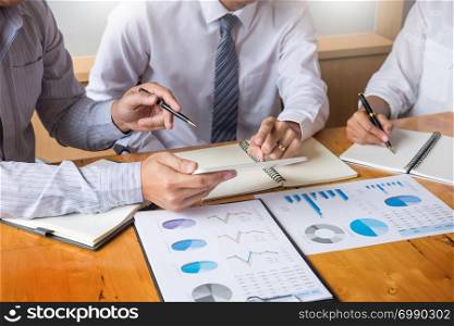 Business team data analyzing income charts document during discussion explain strategy meeting. on start-up project teamwork together