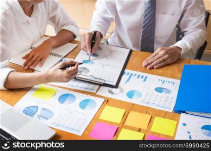 Business team data analyzing income charts document during discussion explain strategy meeting. on start-up project teamwork together